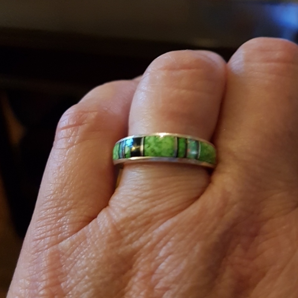 Silver ring with multicolored green stones