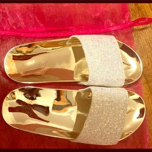 Iridescent white, glittery, metallic gold slides.