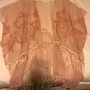 Blush colored poncho with fringe