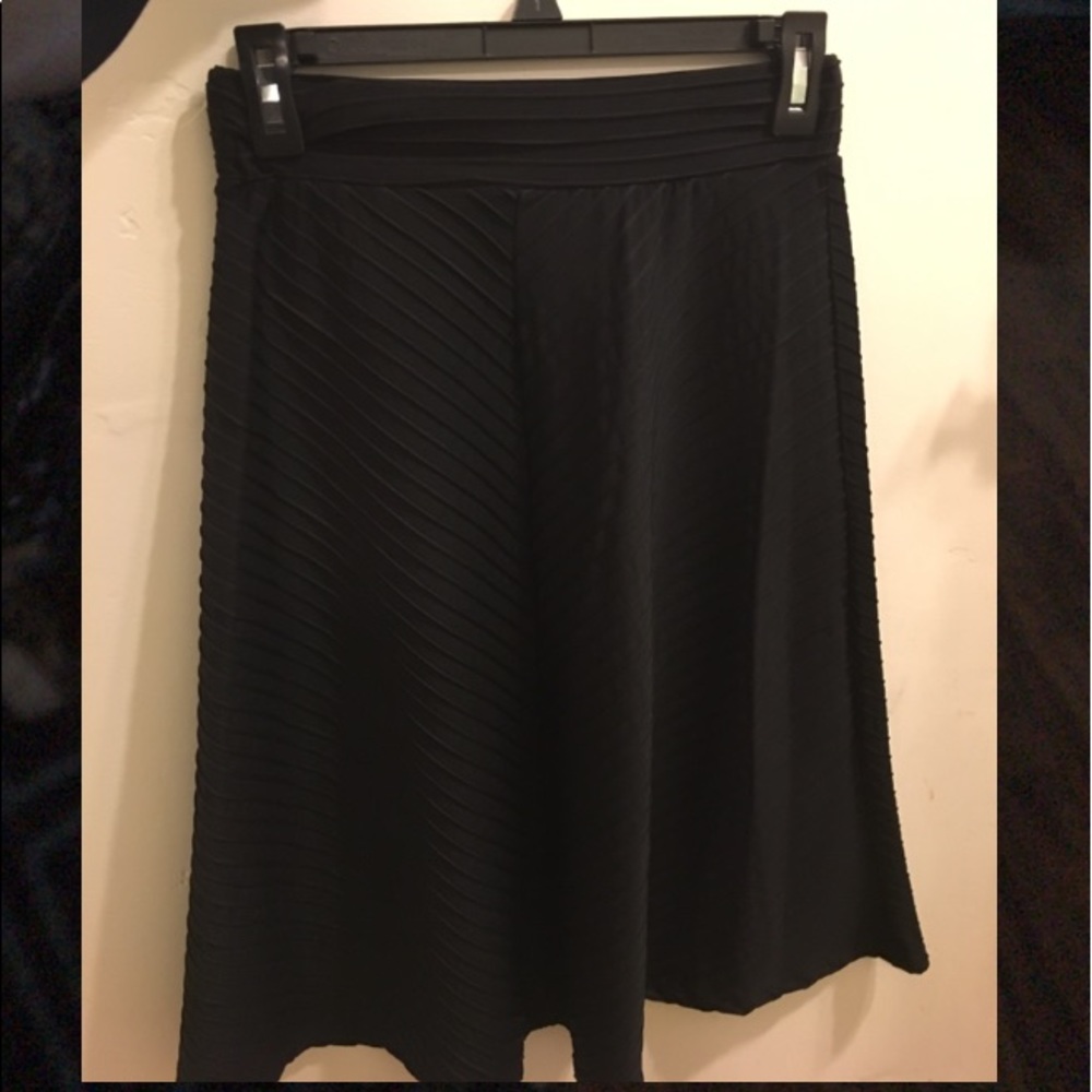 I'm selling this black skirt that is knee length