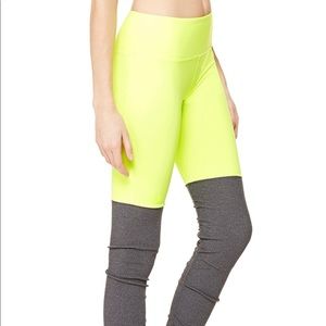 Alo Yoga Goddess Legging in neon yellow and grey.