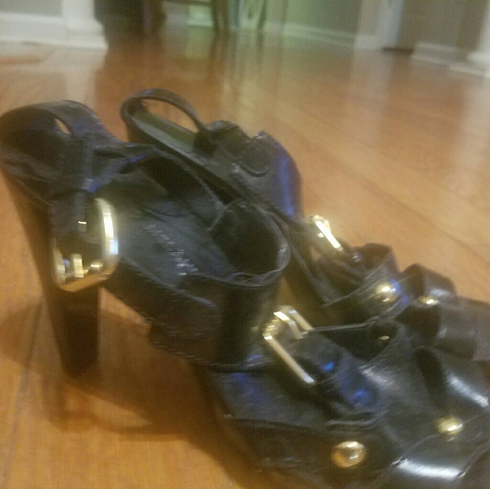 Black and gold buckle shoes