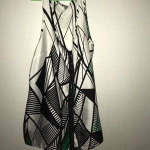 Sheer tank with black & green design.