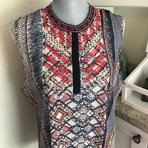 Sleeveless top with embroidered neckline