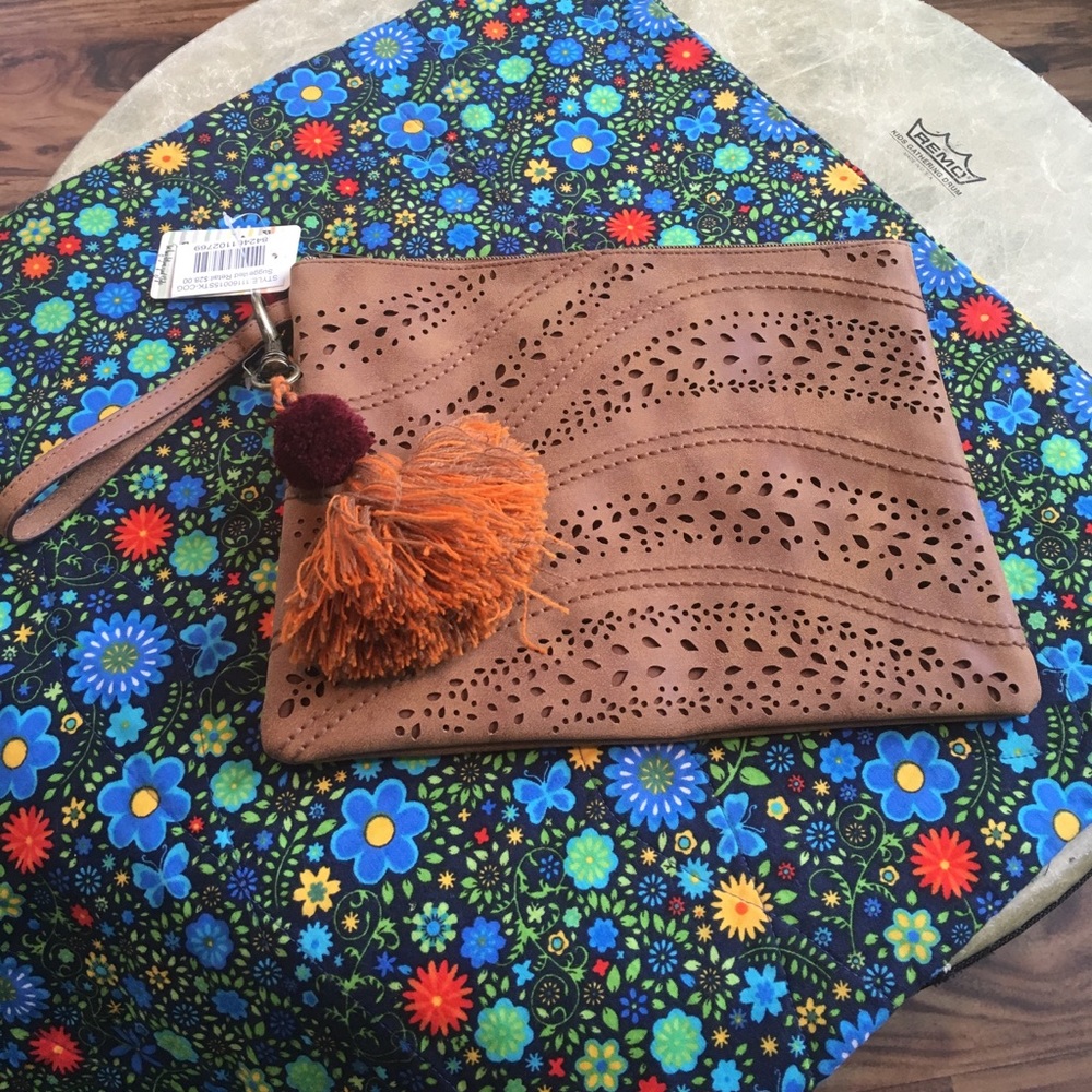Brown laser cut patterned wristlet bag