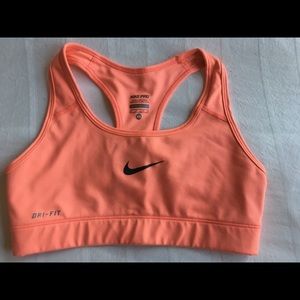 Right orange Nike crop top