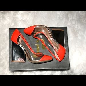 June Ambrose orange and metallic heels