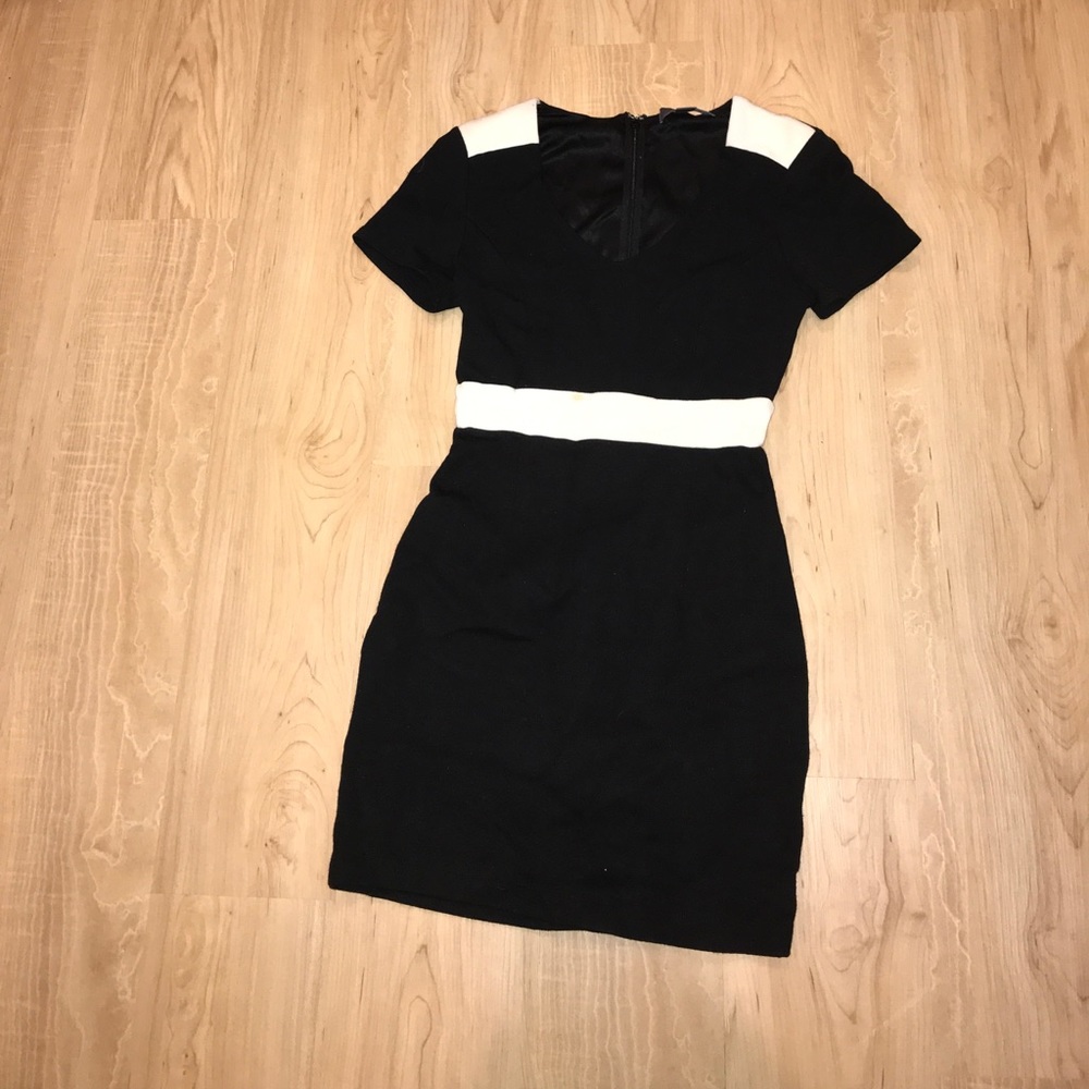 Black and white fitted dress with shoulder pads