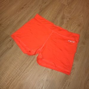 Bright orange workout spandex shorts