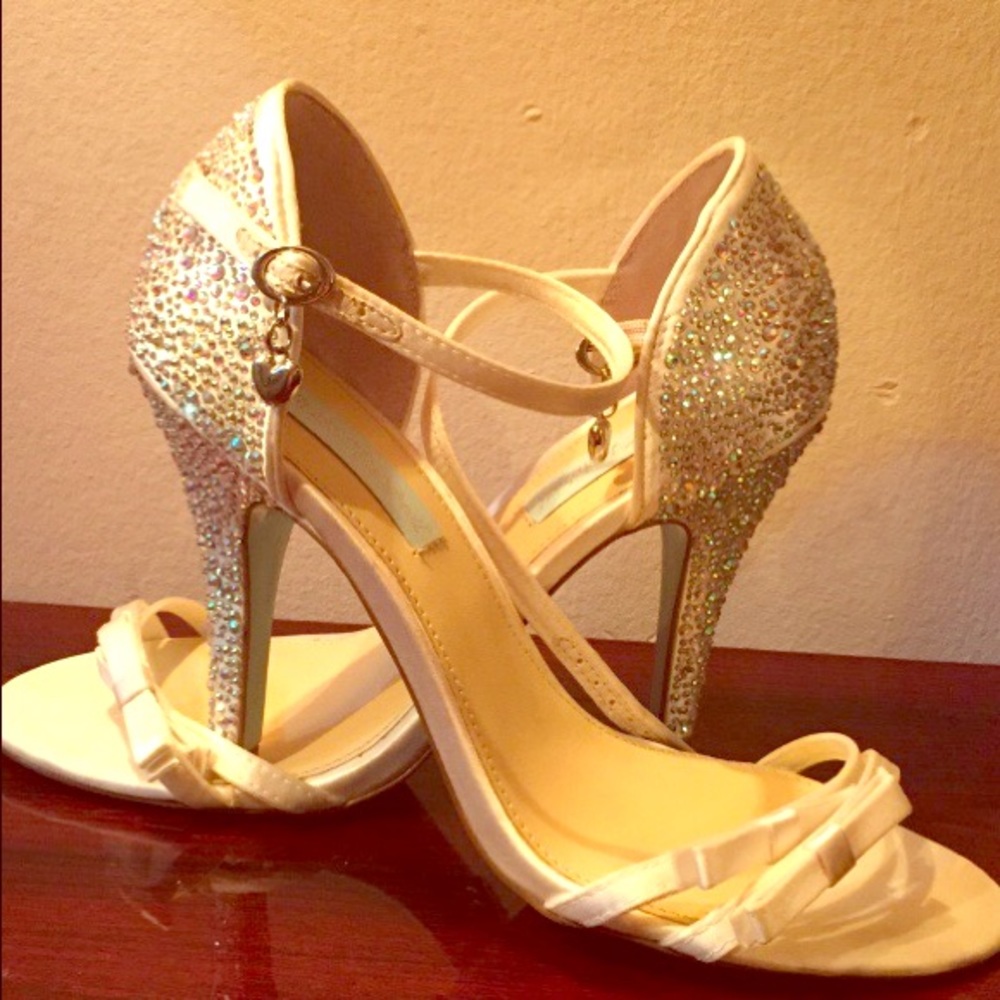 Pair of white leather strap stilettos