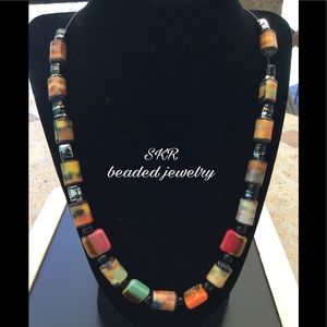 Ladies necklace made with paper beads.