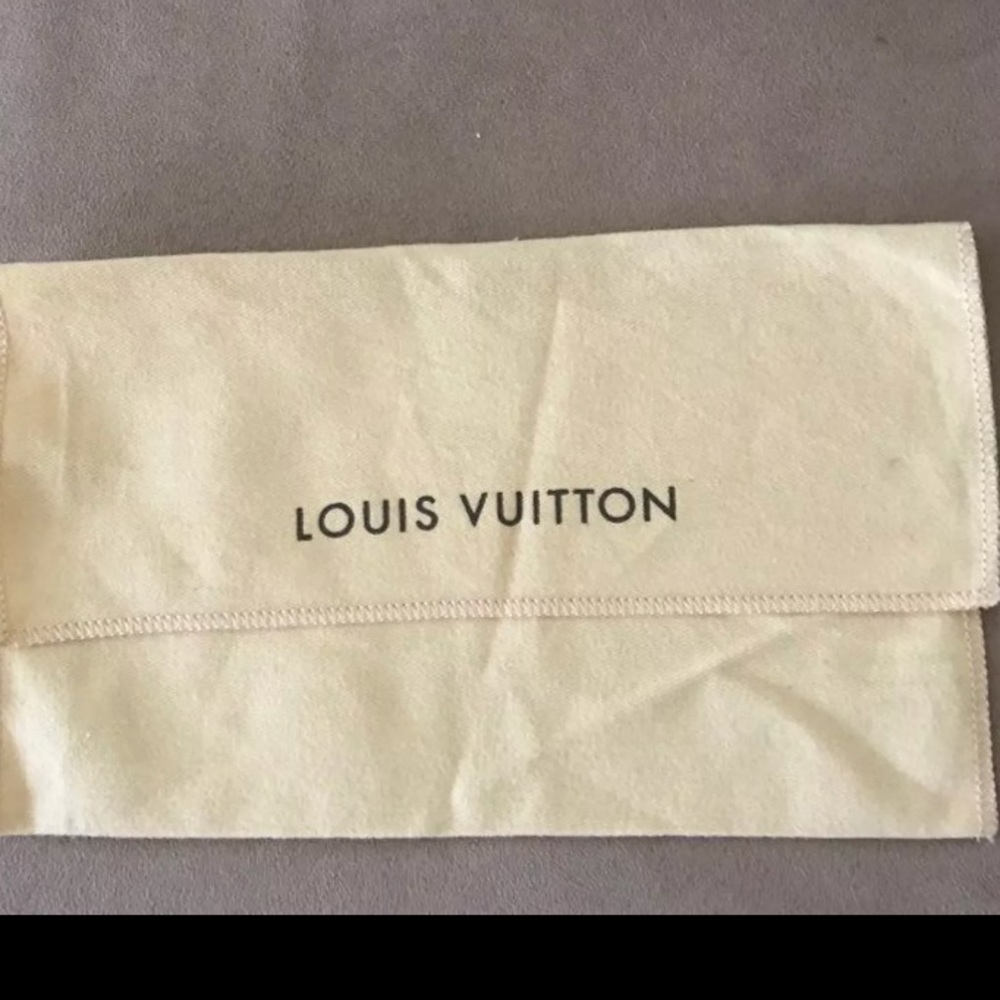 Louis Vuitton wallet dust over