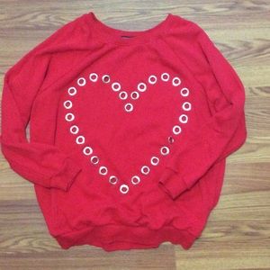 Oversized red sweater with grommet detailing