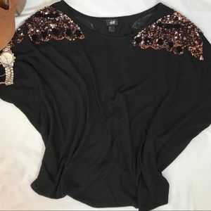 Black top with shoulder detail