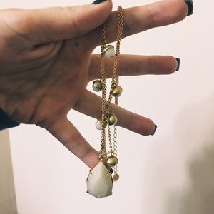 beautiful white and gold layered jeweled necklace