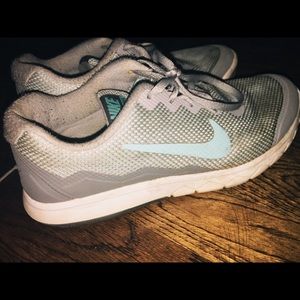 Teal and blue Nike running shoes