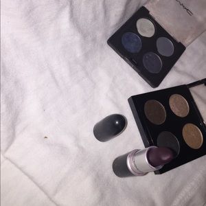 M.A.C eyeshadow palettes and lipstick.