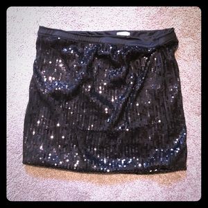 Short, black sequin skirt
