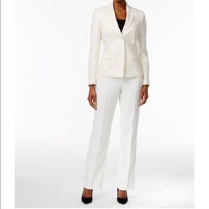 White 2 Piece Pant Suit with a snake print scarf.