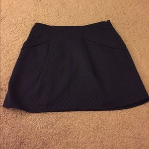 Navy polka dot mini skirt