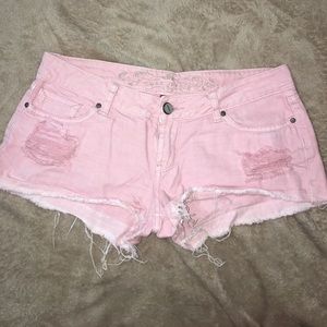 Pink distressed jean shorts