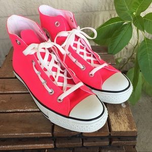 Neon pink high top chucks