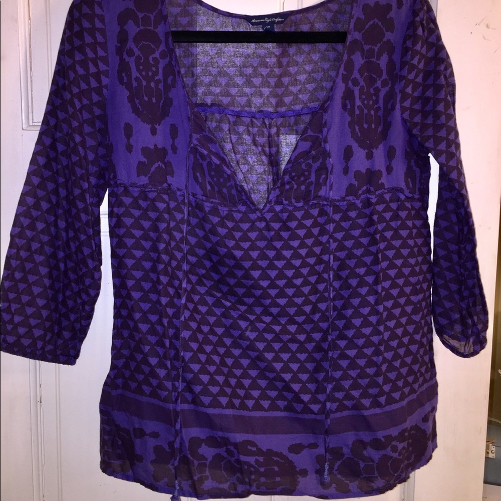 Purple quarter-length sleeved top
