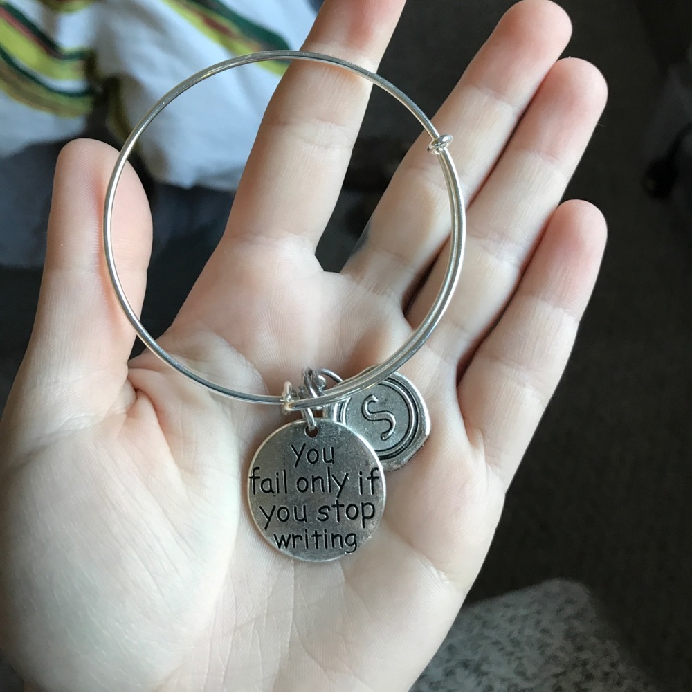 "You fail only if you stop writing" bracelet