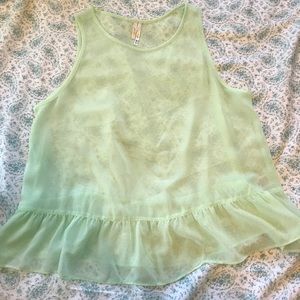 Loose fitting tank top with ruffles at bottom