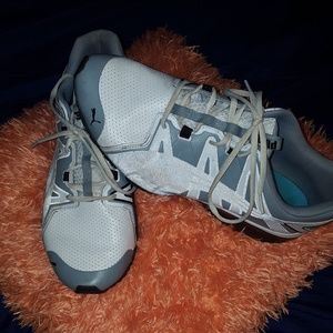 White and gray mens Puma Tennis shoes