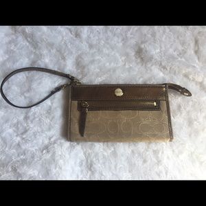 Brown and tan Coach wallet/wristlet