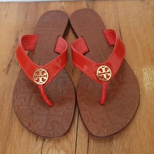 Orange Tory Burch sandals.