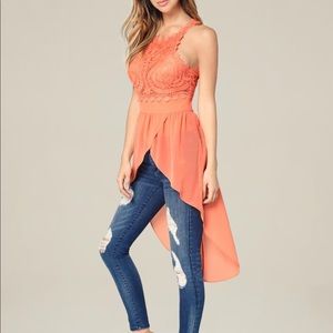 Bebe Hi-lo embroidered top