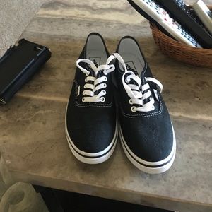 Black and white authentic vans.