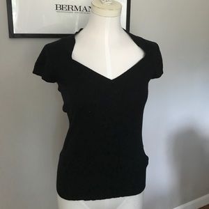 Black V-Neck short sleeve sweater.