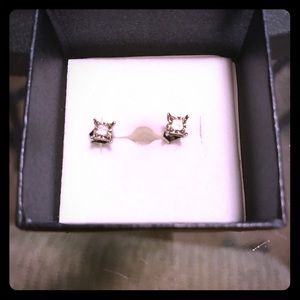 Real diamond stud earrings set in sterling silver.