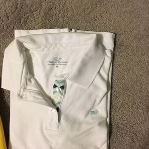 White polo with decorative tab