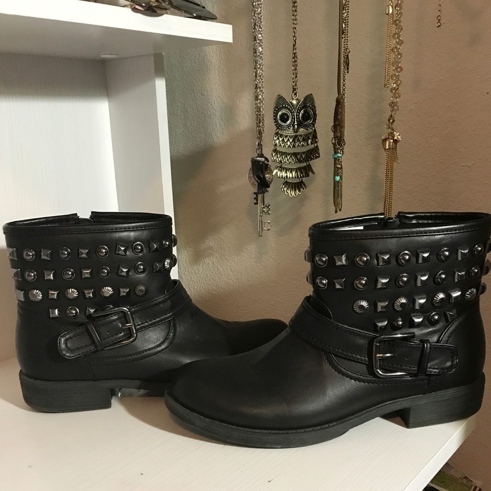 Black studded ankle boots with cross over buckle