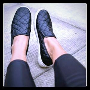 Black quilted slip ons
