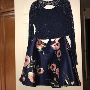 Two Piece Lacy dress with the back cut off.