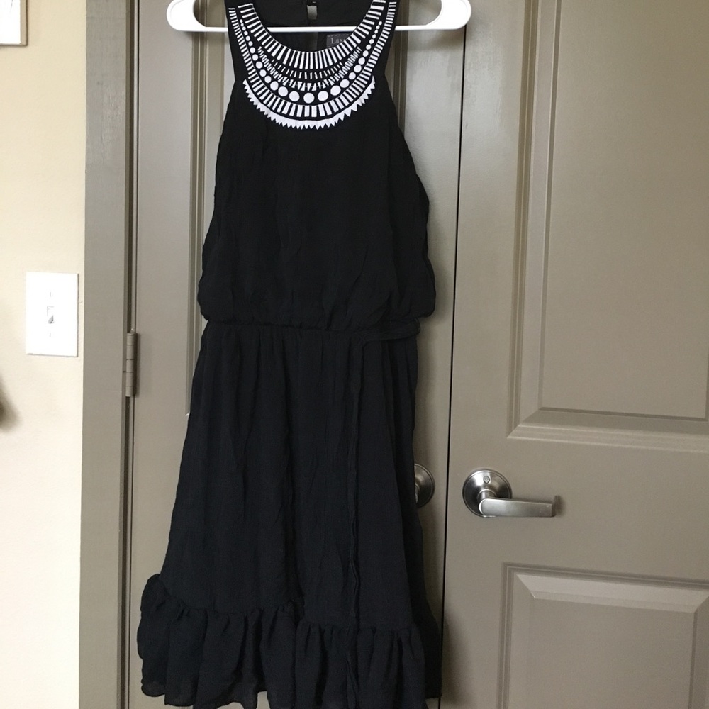 Black dress with embroidered white detailing