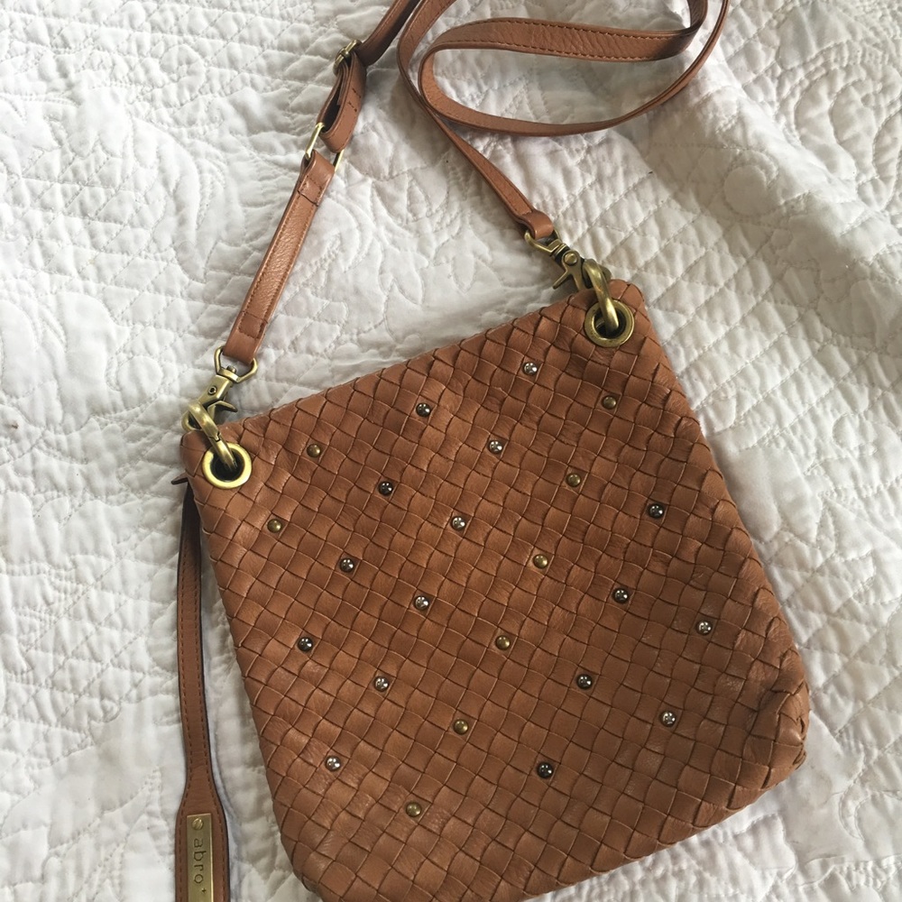 Brown woven leather purse with metallic accents