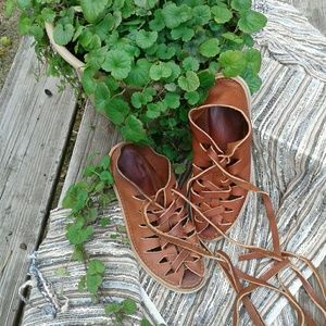 Leather high-tie sandals.