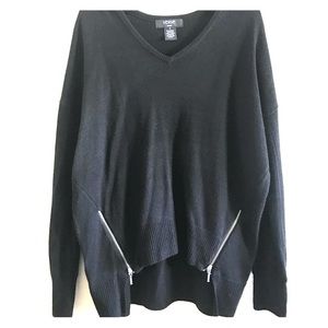 Verve ami black sweater with zippers on the side.