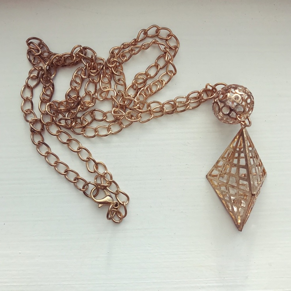 Long gold pullover diamond cage necklace
