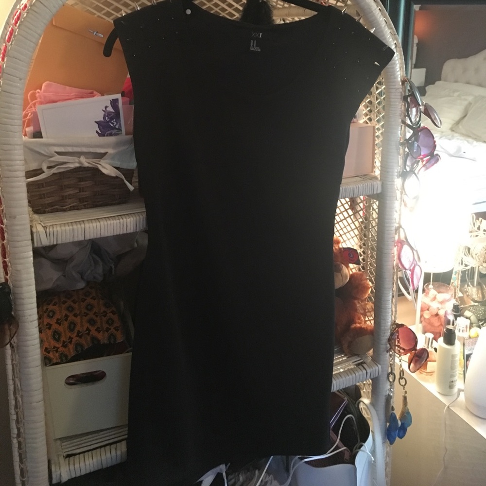 black mini dress with studs and open back