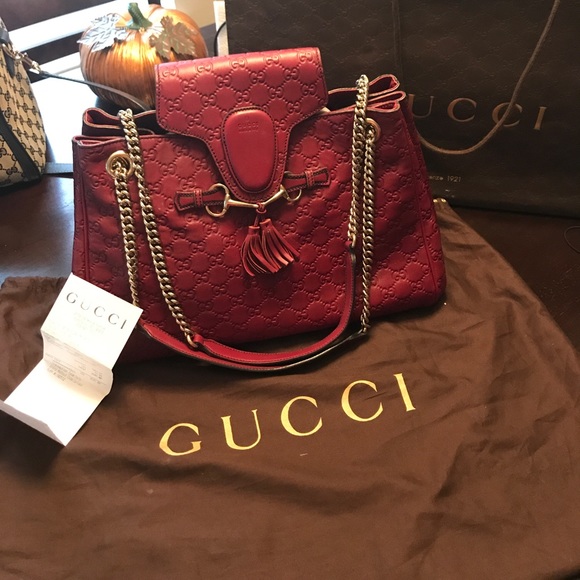Gucci Handbags - Gucci Guccissima burgundy shoulder bag.