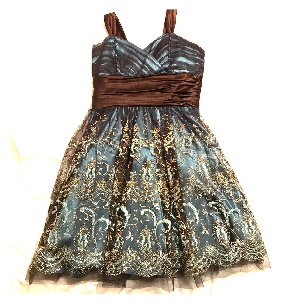 Brow and teal dress with gold sparkles