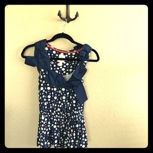 Anthropologie navy blue polka dotted knit top.