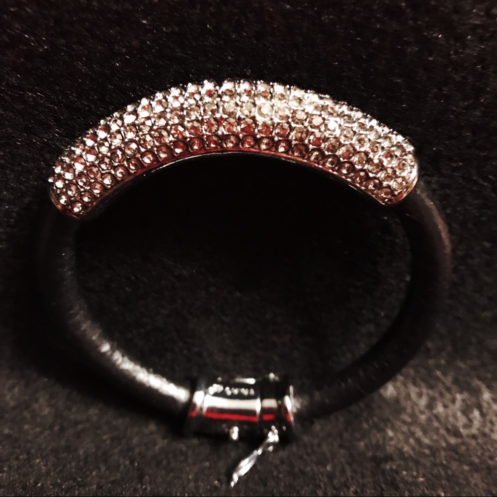 Leather like bracelet with cubic zirconia stones.